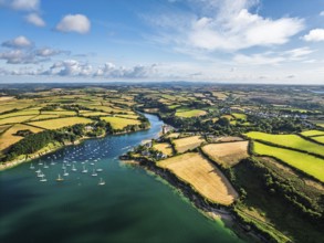 Farms and Fields over St Mawes from drone, Carrick Roads, River Fal, Falmouth, Cornwall, UK