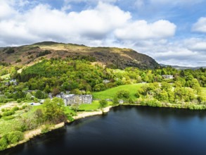 Farms and Mountains over road A591 from a drone, Grasmere Lake, Grasmere, Ambleside, Lake District,