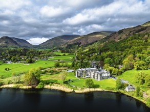 Farms and Mountains over road A591 from a drone, Grasmere Lake, Grasmere, Ambleside, Lake District,