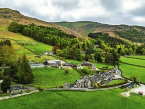 Farms and Mountains over road A591 from a drone, Grasmere Lake, Grasmere, Ambleside, Lake District,
