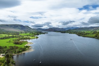 Farms and mountains over Ullswater Lake from drone, Pooley Bridge, Lake District National Park,
