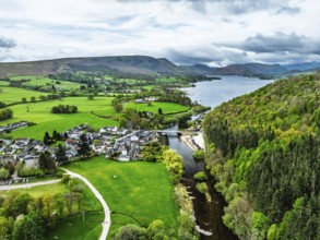 Farms and mountains over Ullswater Lake from drone, Pooley Bridge, Lake District National Park,