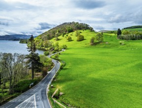 Farms and mountains over Ullswater Lake from drone, Pooley Bridge, Lake District National Park,
