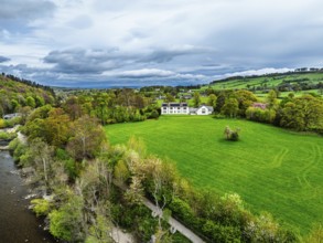 Farms and mountains over Ullswater Lake from drone, Pooley Bridge, Lake District National Park,