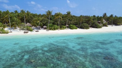 Aerial view Bird's eye view of lagoon and white beach Sandsztanf with coconut palms (Cocos