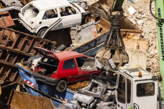 Scrap metal trade in the commercial harbour of Mannheim. Scrap vehicles and scrap metal. Mannheim,
