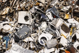 Scrap metal trade in the commercial harbour of Mannheim. Disused household appliances, washing