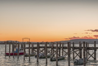 Sunset over a wooden footbridge in Allensbach, Lake Constance, Baden-Württemberg, Germany
