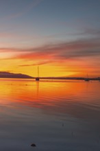 An atmospheric sunset over Lake Constance, Allensbach, Baden-Württemberg, Germany