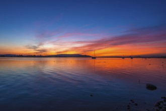 An atmospheric sunset over Lake Constance, Allensbach, Baden-Württemberg, Germany