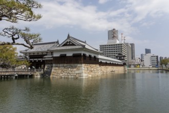 Hiroshima Castle, also known as Carp Castle, entrance gate and moat, replica of the original