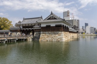 Hiroshima Castle, also known as Carp Castle, entrance gate and moat, replica of the original