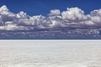Cloudy sky over a flat salt landscape with a calm atmosphere, The endless expanses of the salt