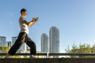 Solo martial arts training on a sunny day in the city