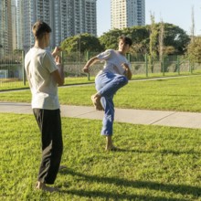 Young martial artists sparring with focus and determination