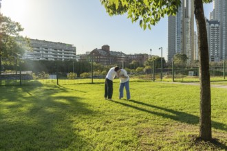 Young martial artists training in the park
