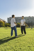 Young martial artists greeting each other before a training session