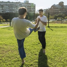 Young martial artists practicing a precise kick