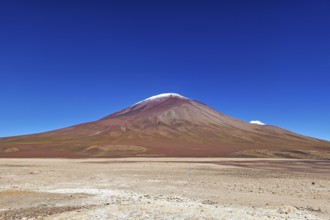 Majestic volcano in the middle of a dry, barren desert landscape, The landscape of the Altiplano in