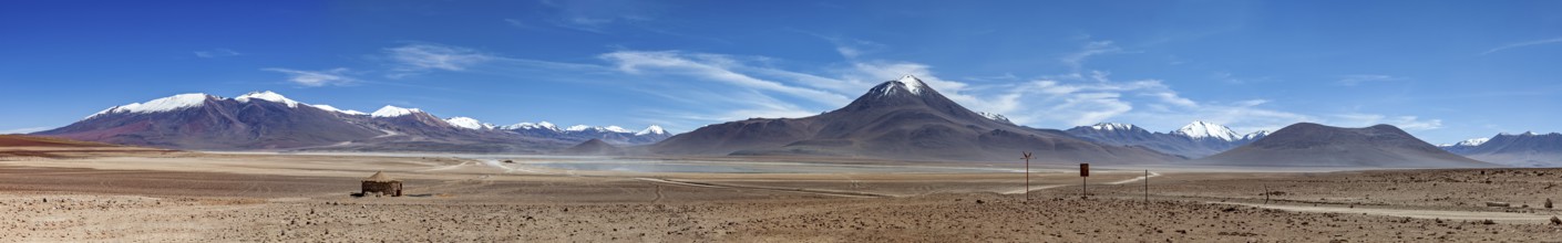 Panoramic view of arid desert and massive, snow-capped mountains, The landscape of the Altiplano in