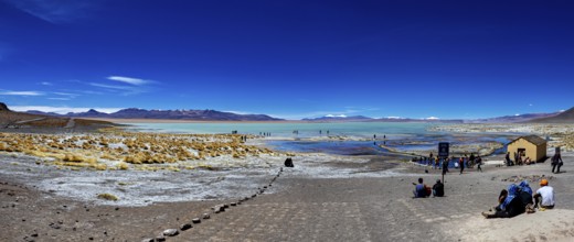 Panorama with sweeping views over a lake and mountains in an arid desert landscape, The Aguas