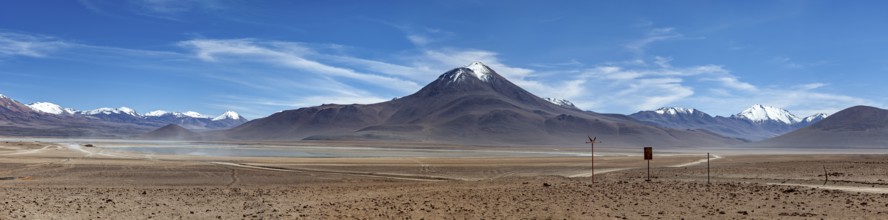 Panorama of a vast desert landscape with snow-capped mountains, The landscape of the Altiplano in