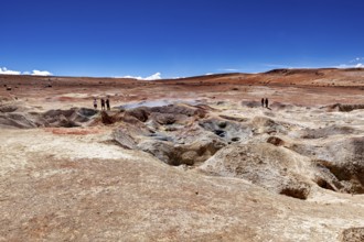A glistening sky over vast desert plains with geysers and people in the distance, The mud volcanoes