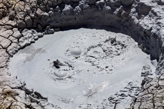 Close-up of a cracked crater covered with muddy bubbles, The mud volcanoes and fumaroles on the