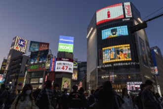Crowd crossing the zebra crossings of Shibuya Crossing, world-famous intersection in Shibuya