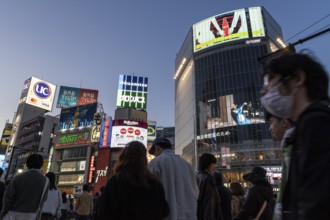 Crowd crossing the zebra crossings of Shibuya Crossing, world-famous intersection in Shibuya