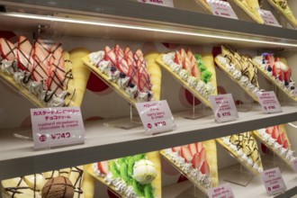Plastic display specimens in the window of a shop for Japanese crepes in Takeshita-dori, Takeshita