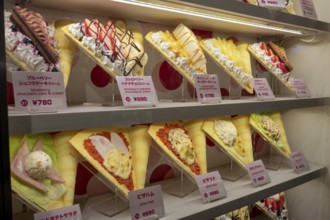 Plastic display specimens in the window of a shop for Japanese crepes in Takeshita-dori, Takeshita