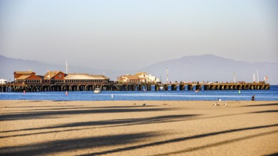 A panoramic view of Stearns Wharf and the beach in Santa Barbara, featuring the iconic pier