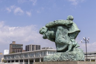 Statue of mother and children in the storm, bronze statue by the artist Shin Hongo in front of the