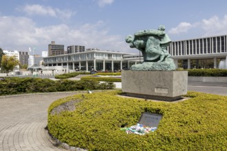 Statue of mother and children in the storm, bronze statue by the artist Shin Hongo in front of the