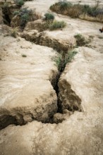 Cracks in arid soil reveal changes caused by erosion, in bardenas reales in spain, highlighting the