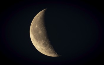 Waxing moon in the clear night sky. Niederursel, Frankfurt am Main, Hesse, Germany