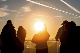 The golden hour delights visitors to the Main Tower. Banking district, Frankfurt am Main, Hesse,