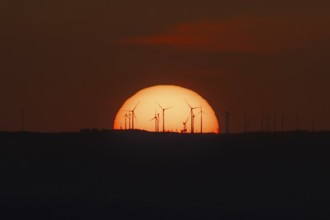 Sunset over a wind farm. Großer Feldberg in the Taunus, Hesse, Germany