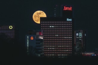 Glowing full moon over the Main metropolis. Frankfurt am Main, Hesse, Germany