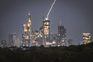 Lightning strikes over Frankfurt, force of nature in the centre of the city. City centre of