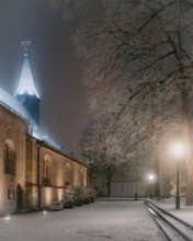Industrial snow in the historic heart. Justinuskirche, Alt Höchst, Frankfurt am Main, Hesse,