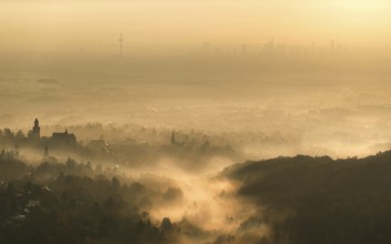 Frankfurt skyline sinks into the early morning fog. Dettweiler Tempel, Königstein im Taunus, Hesse,