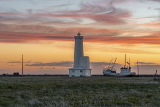 Icelandic lighthouse with a play of colours in the sky. Gardur, Reykjanes, Iceland