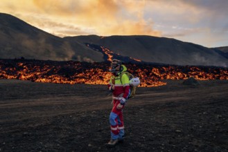 Icelandic ranger watches over lava field. Fagradalsfjall, Reykjanes, Iceland