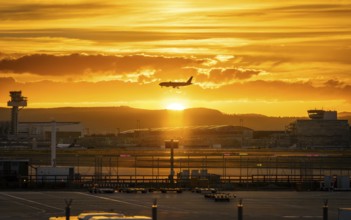 Silhouette of a jet at sunset. Frankfurt Airport, Hesse, Germany
