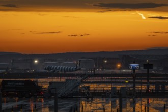 A plane lands shortly after a thunderstorm. Frankfurt Airport, Hesse, Germany