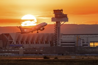 Departure between tower and sunset. Frankfurt Airport, Hesse, Germany