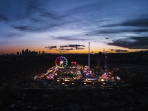 Folk festival with neon lights against skyline silhouette. Riederwald, Frankfurt am Main, Hesse,
