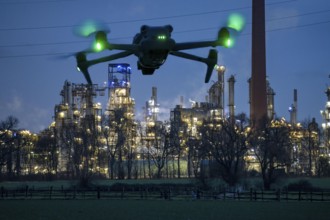 Symbolic image, photomontage, reconnaissance, spying with drones in industrial plants, critical